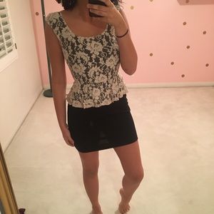 A black and white lace peplum dress